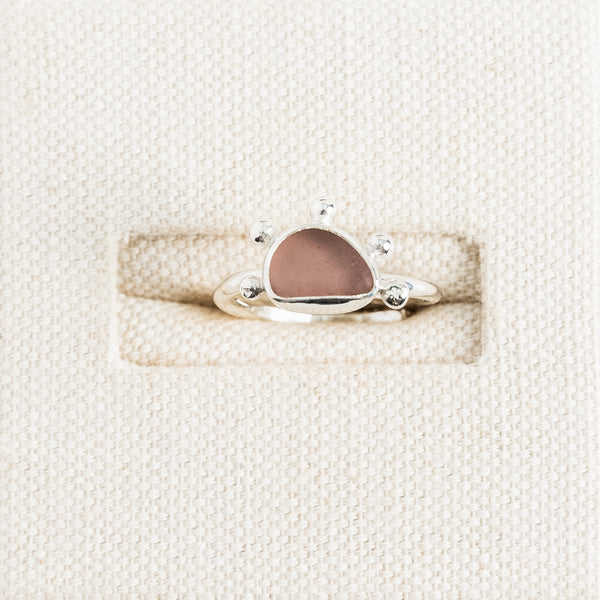 Rare pink sea glass ring with handmade sterling silver sunburst setting by Broken Wave Jewellery Cornwall
