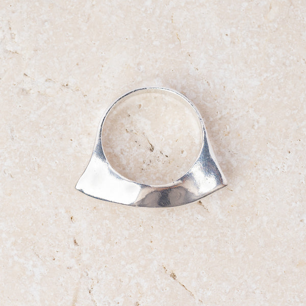 Wave ring in recycled sterling silver with a sculptural curved top, handmade in Cornwall