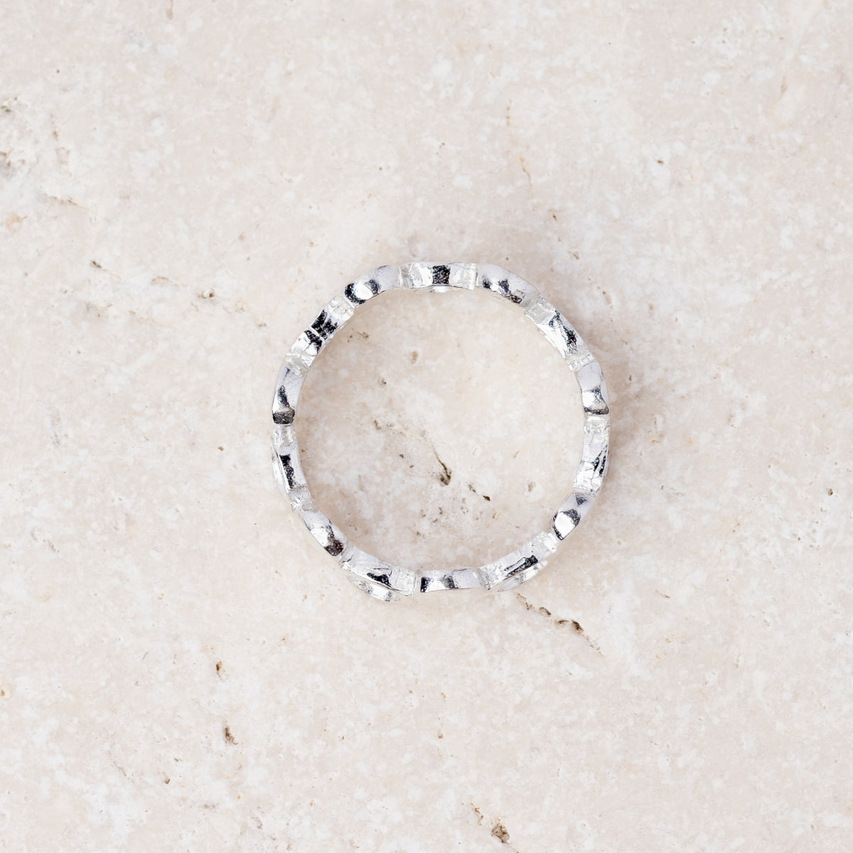 Pebble ring from above showing the full band of silver pebbles
