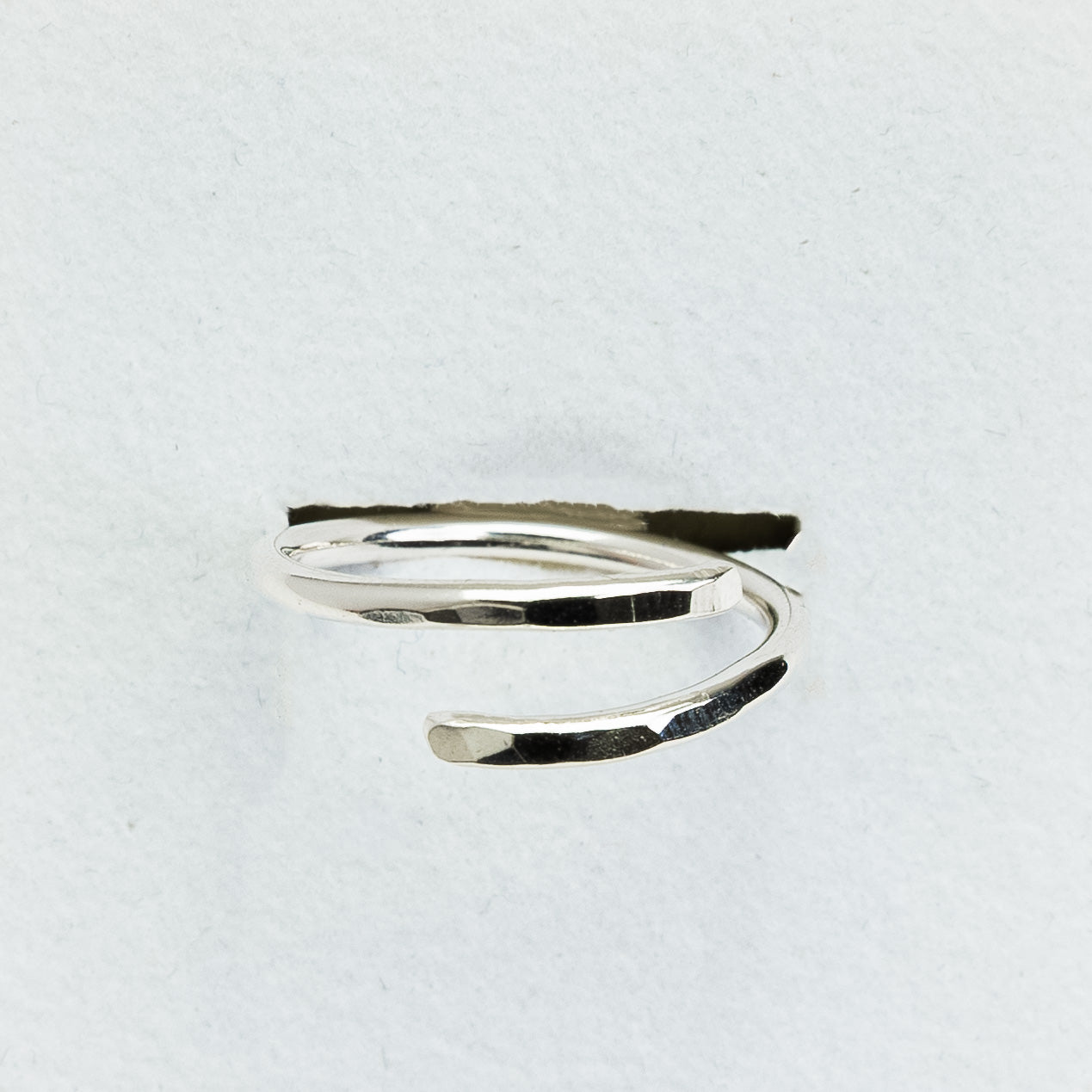 Back of sea glass ring on a light gray background