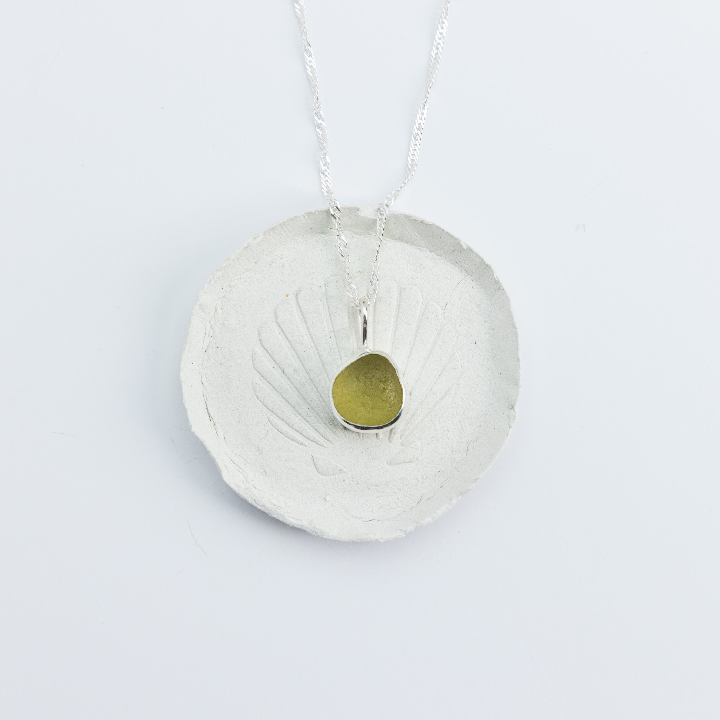 Citron sea glass necklace on white background, handmade sterling silver, Broken Wave Jewellery
